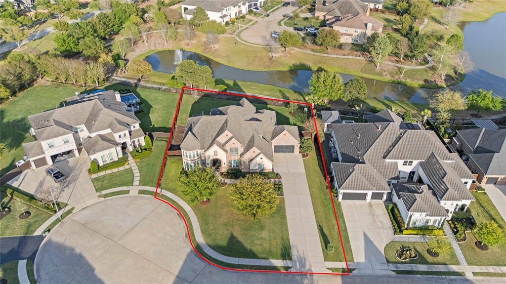 This impressive aerial view showcases the prime location of this lot, perfectly positioned with a scenic lake backdrop.