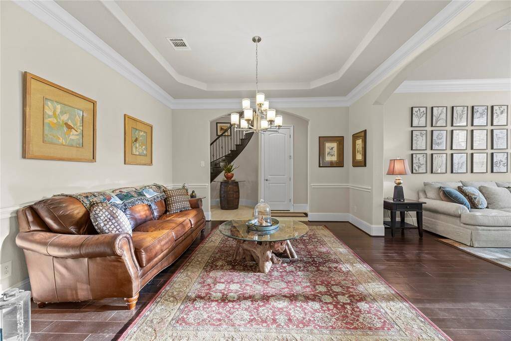 This chic sitting room is a stylish sanctuary, thoughtfully designed for both comfort and conversation.