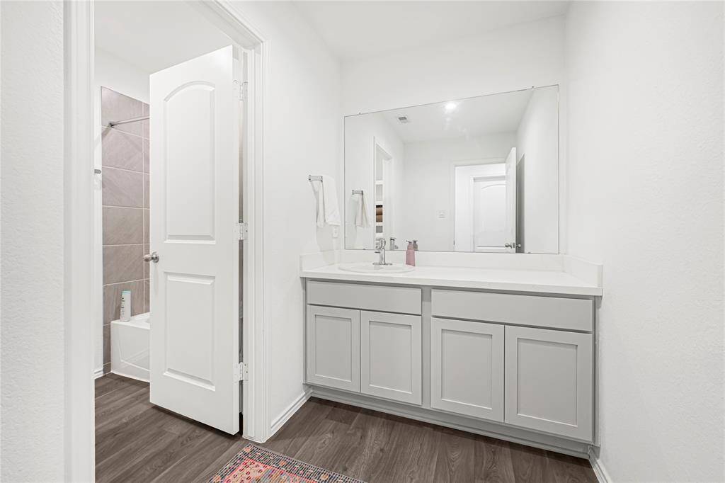 Hallway bathroom with upgraded quartz countertops