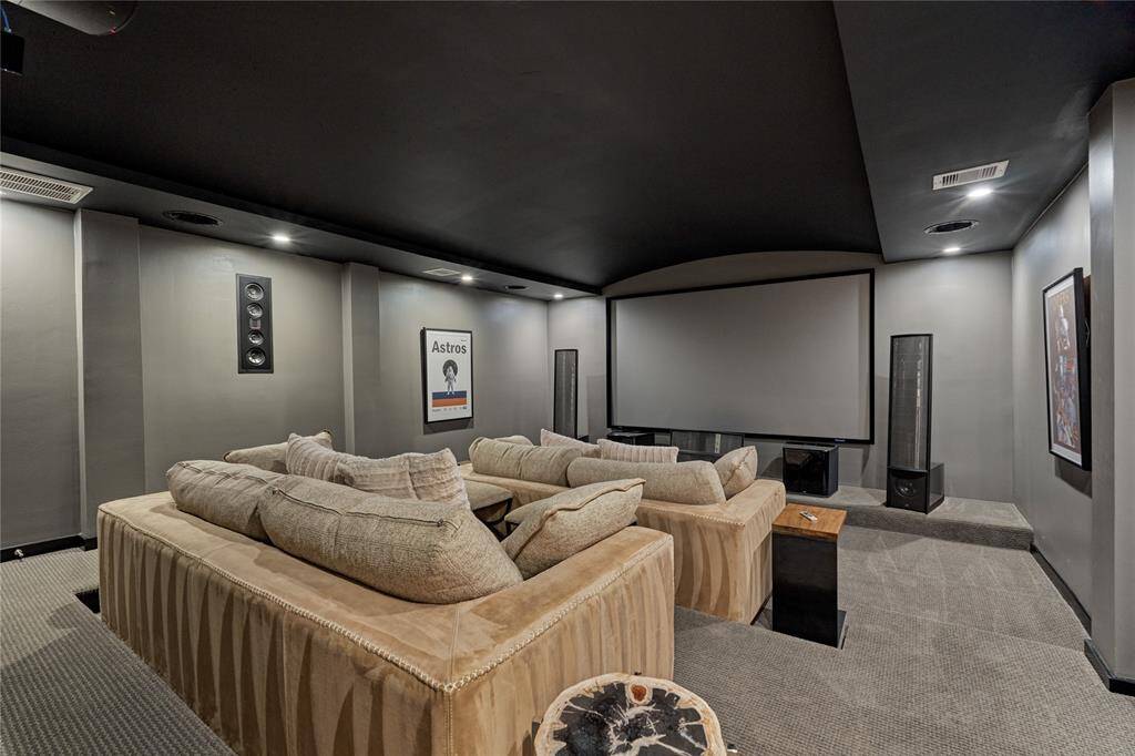 Here we have the media room where family movie night is fun entertainment for all to enjoy! A Sony 4K Projector and a Denon AV Receiver convey with the home.