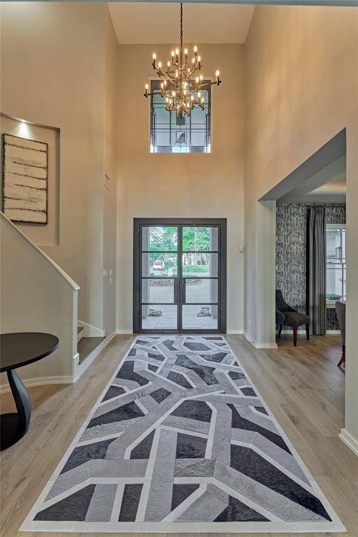 A magnificent chandelier sets the tone for this truly amazing home and rich wood flooring continues throughout the entire first floor.