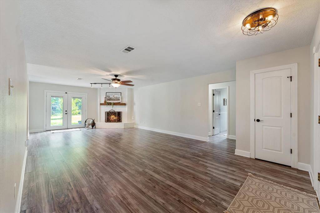 All bedrooms are conveniently located to the right of the spacious living area.