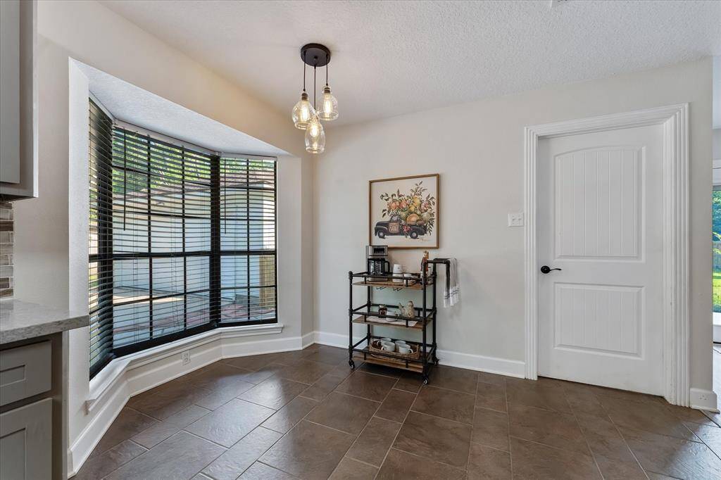 Cozy eat-in kitchen with a bright bay window.