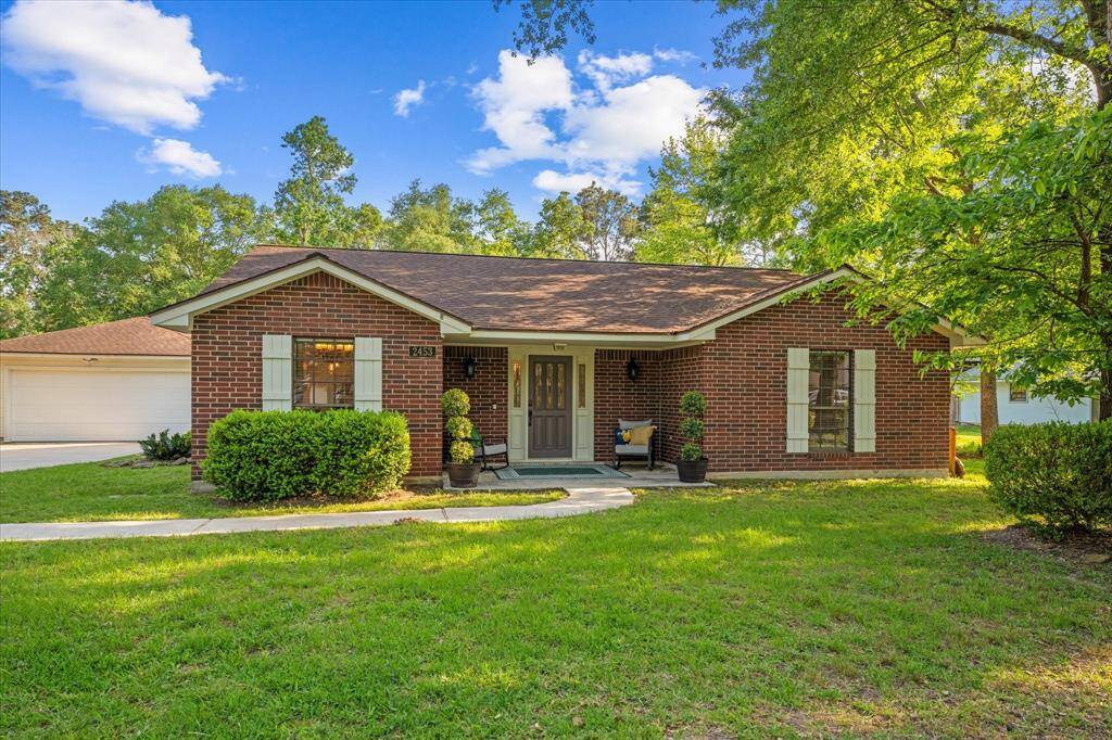 Charming updated single-story home nestled on a stunning tree-lined lot.