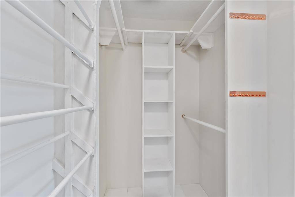 Spacious closet with custom organizational features for enhanced storage.