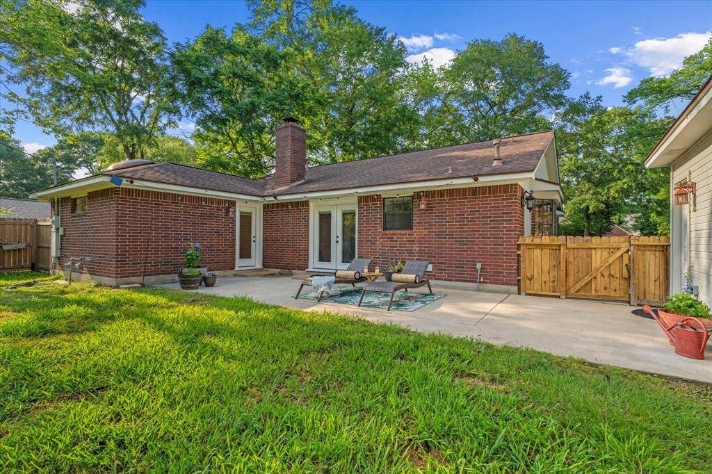 Easy driveway access to the inviting patio through a convenient gate.