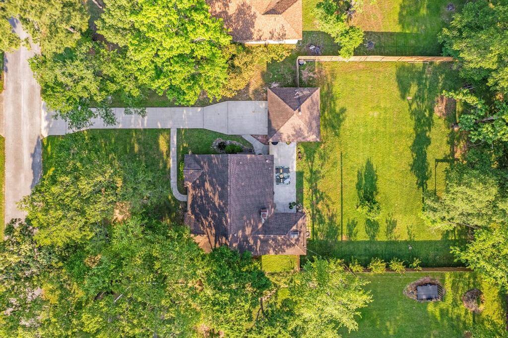 Expansive, nearly half-acre lot with lush natural landscaping.