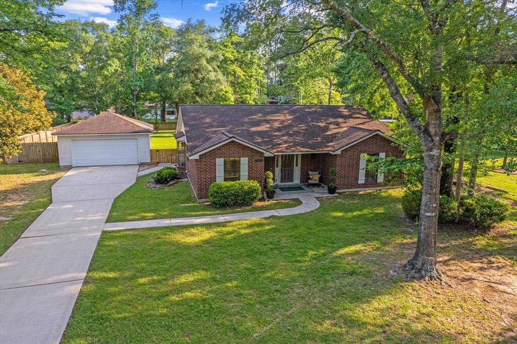 Expansive detached garage offers ample space for storage and projects.