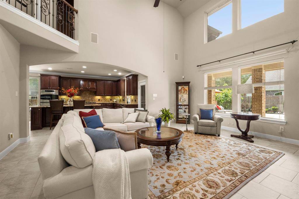 Soaring ceilings with catwalk views from above—elegance meets openness.