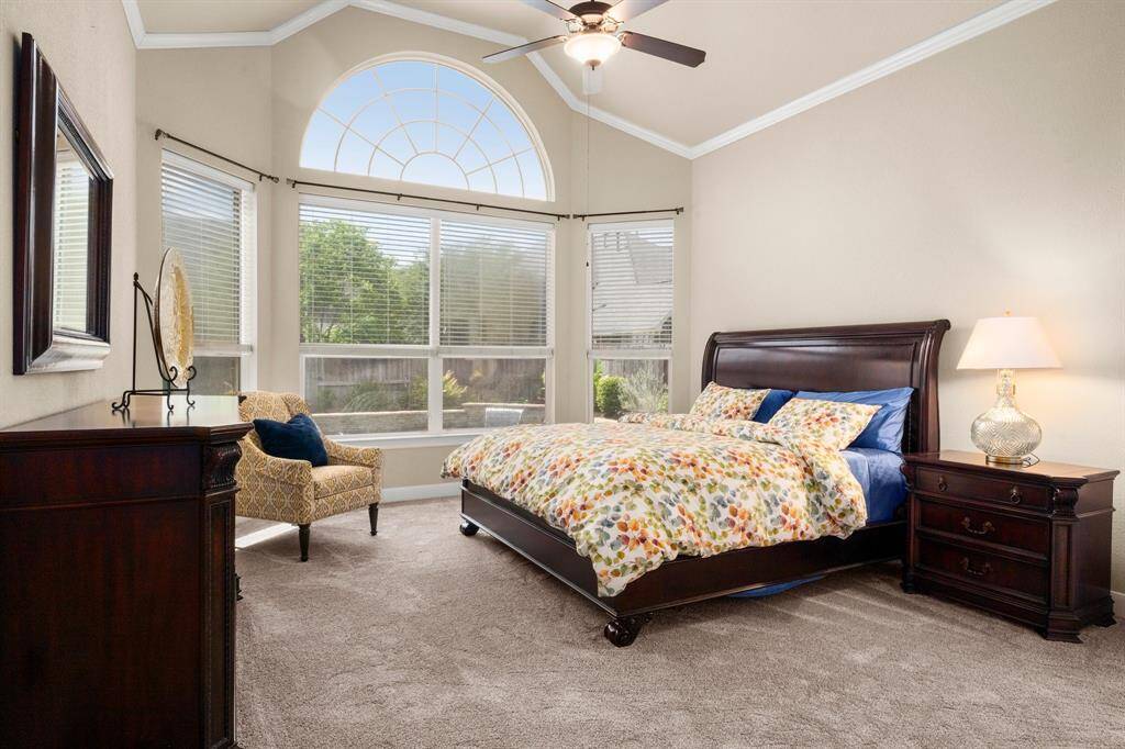 Spacious and serene, featuring brand-new carpet and large windows overlooking the backyard.
