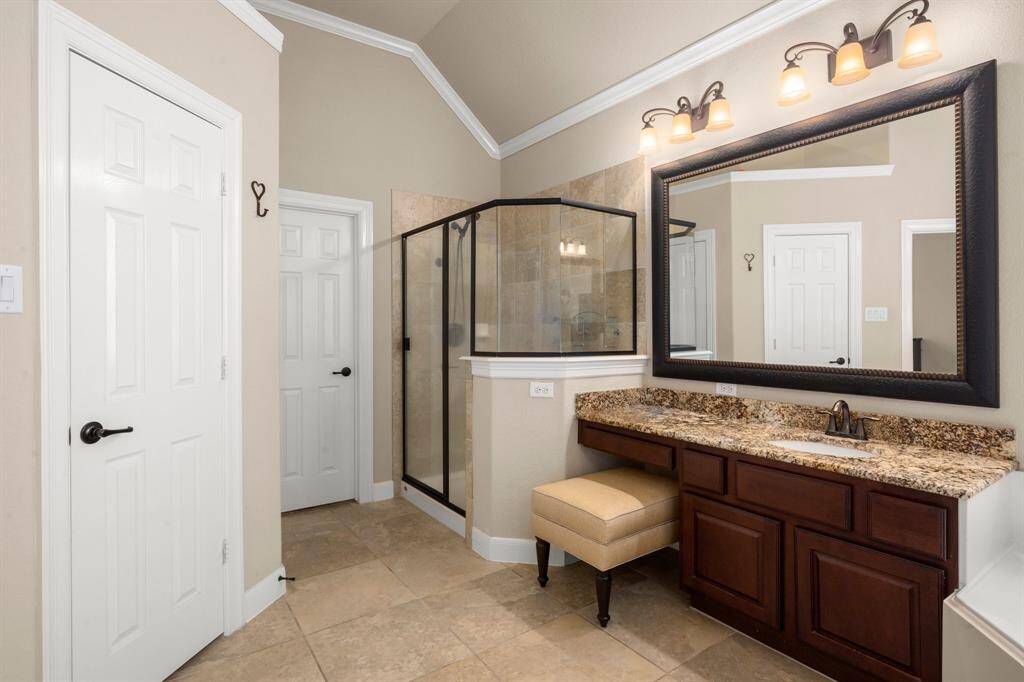Spa-inspired design featuring a Jacuzzi soaking tub and a large walk-in shower.