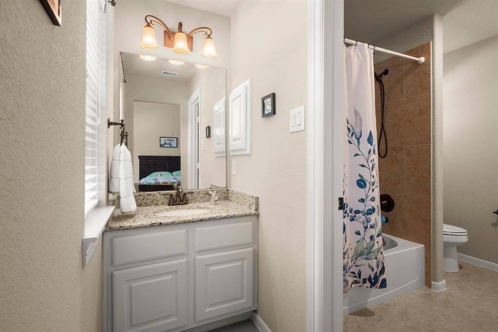 Jack-and-Jill bath connects two rooms.