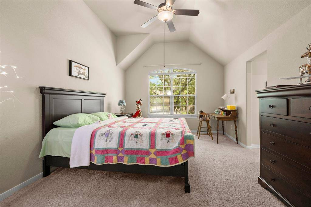 Each bedroom offers a walk-in closet and ceiling fan—comfort and practicality. Neutral carpet and blinds provide a fresh start for any style.