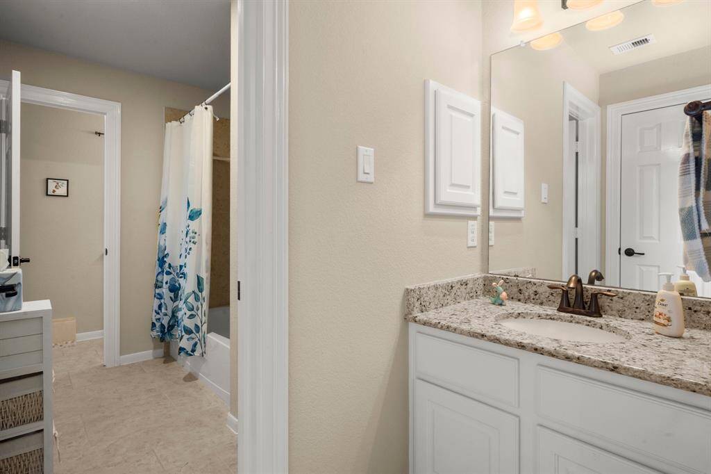 Jack-and-Jill bath connects two rooms.