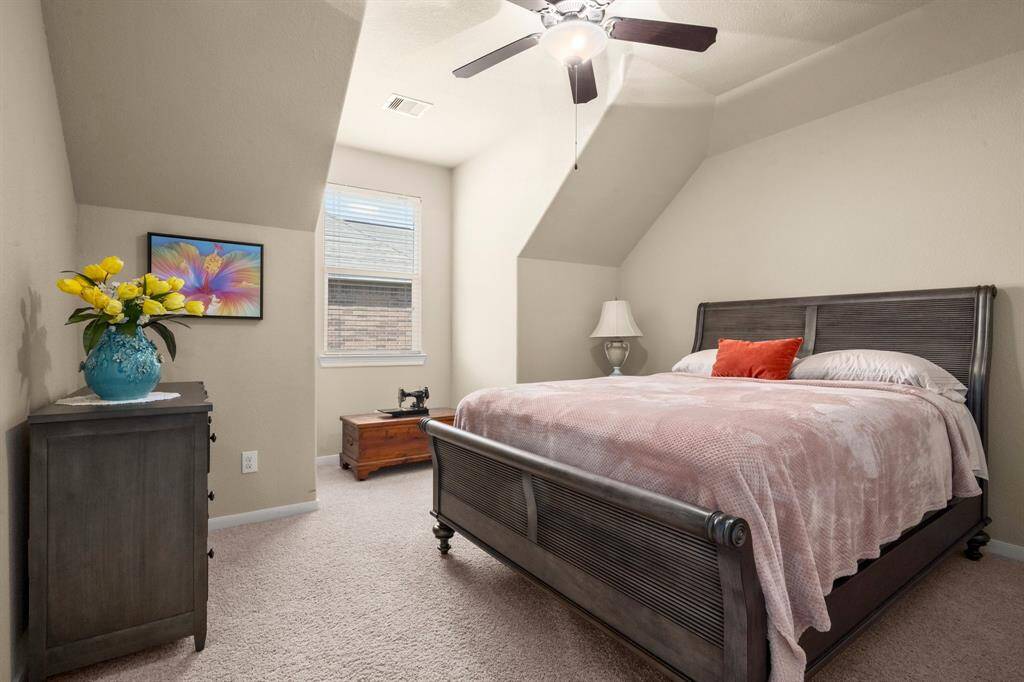 Each bedroom offers a walk-in closet and ceiling fan—comfort and practicality. Neutral carpet and blinds provide a fresh start for any style.