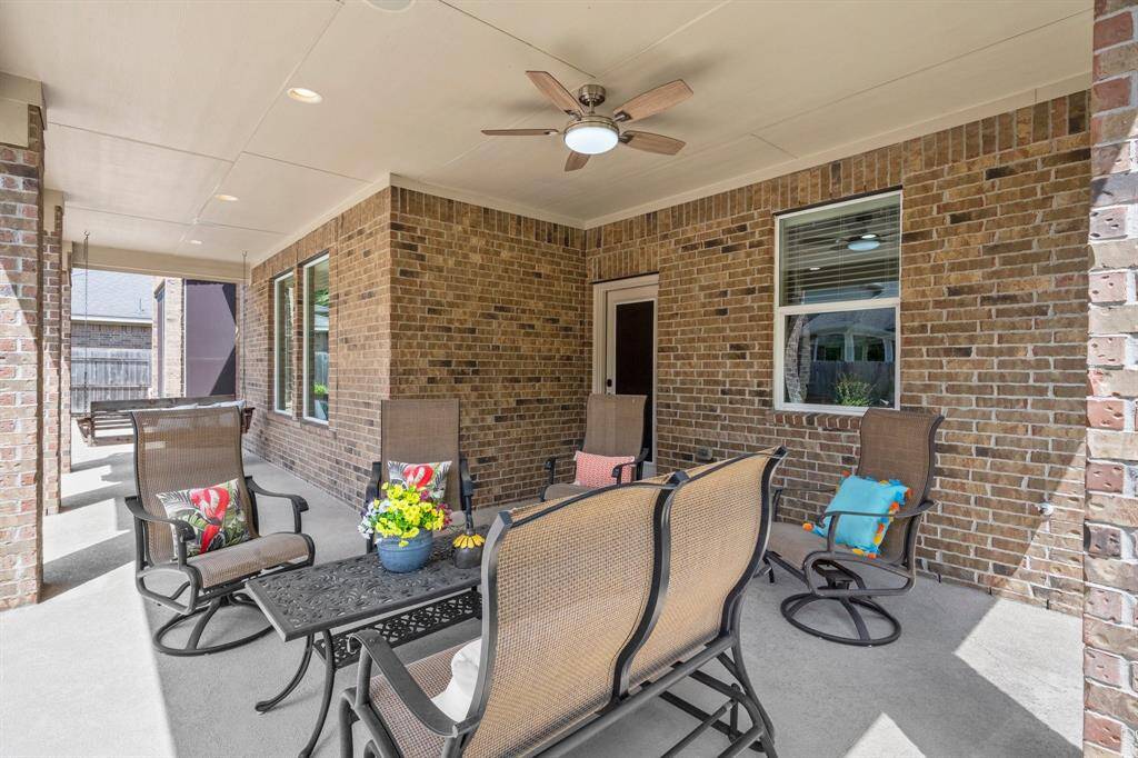 Wonderful covered patio with ceiling fan to cool you off on those hot summer days.