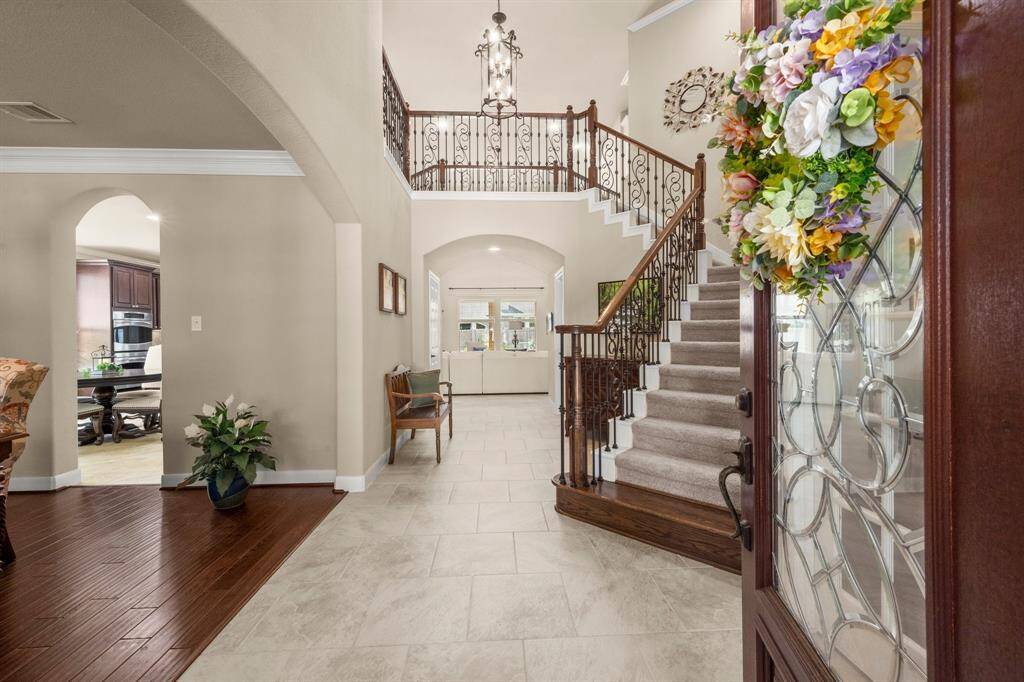 Beveled glass front door offers a warm and stylish first impression.
