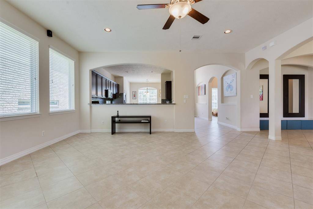 Open floor plan living room and a view looking towards the kitchen.