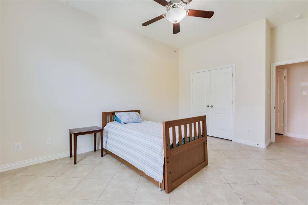 Fourth bedroom. Notice the tile floors in every room. This is ideal for easy cleaning and to keep out odors.