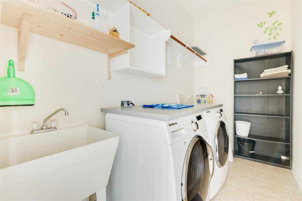 The utility room with built-in sink and storage space! This is the space you need!