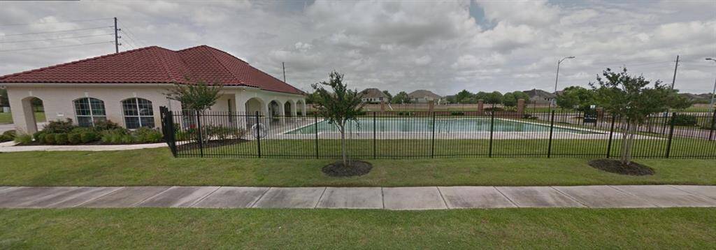 A view of the community clubhouse and pool. You will love this family-friendly community.