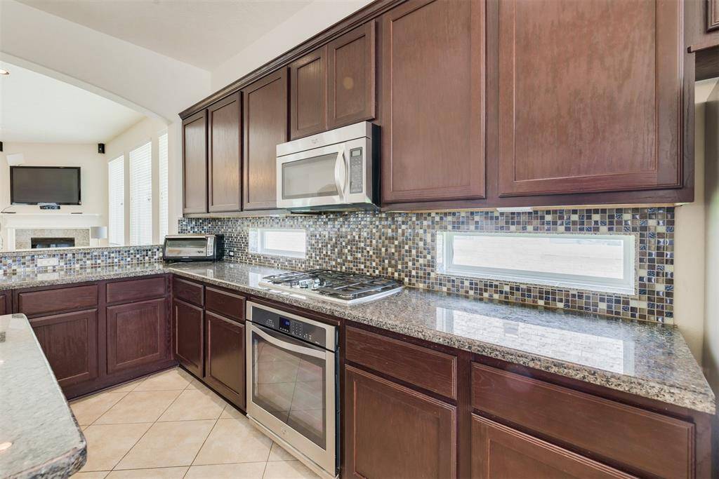 This home comes with a gas-range cooktop!