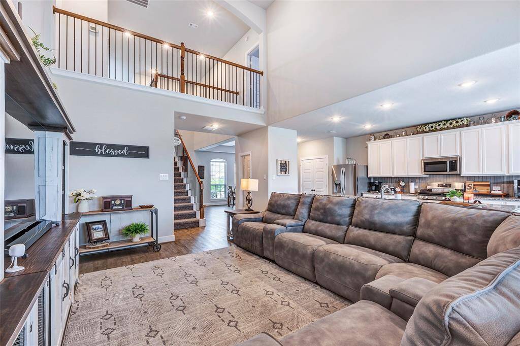 An open and airy layout, this view captures the perfect flow between the spacious living room and the beautifully designed kitchen.