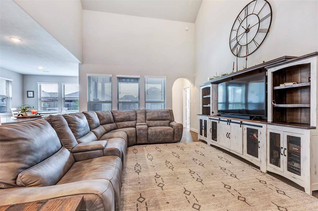The large windows in the living area flood the space with natural light, creating a warm and inviting atmosphere throughout the home.