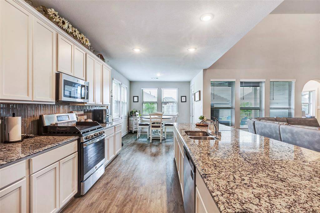 From this vantage point in the kitchen, enjoy a lovely view of the cozy breakfast room – the perfect spot for casual meals and morning coffee.