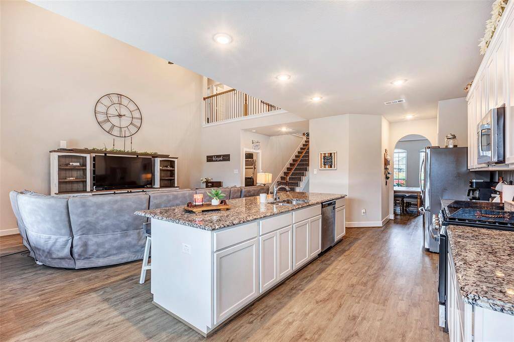 This view captures the seamless flow between the kitchen and living area.
