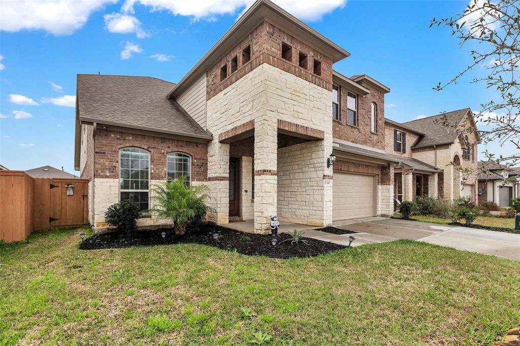 This home's timeless elegance meets durability with its stunning brick and stone exterior, offering both charm and lasting appeal.