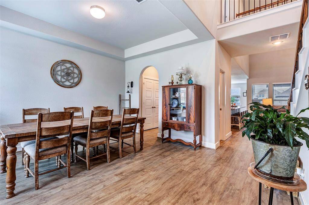 Elegance and warmth come together in this spacious dining area, perfect for hosting gatherings or intimate meals.