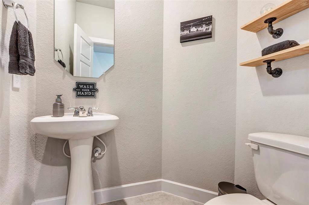 The convenient half bath offers comfort and privacy just off the main living areas.