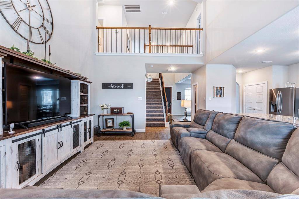 Cozy and stylish, this living room offers a closer look at its inviting space, with a seamless view of the kitchen just beyond.