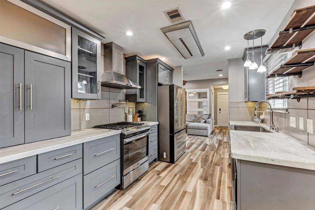 An additional view of the kitchen highlights the thoughtful layout of furnishings, offering a clear sense of flow and functionality throughout the space.