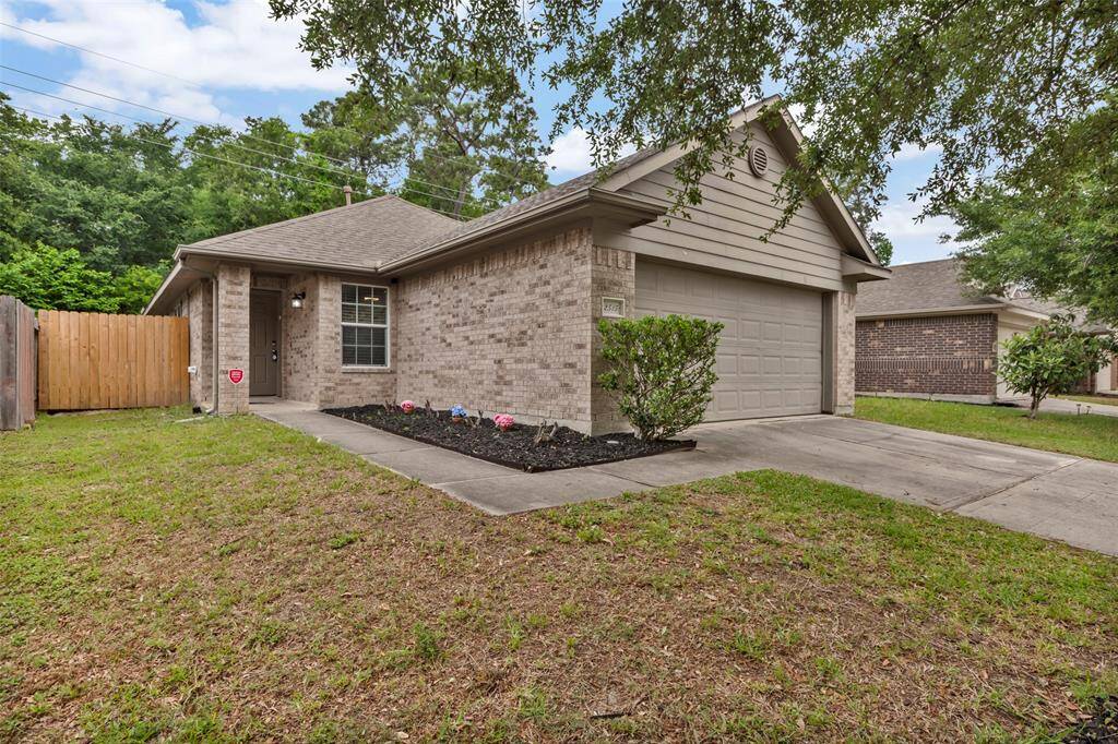 This home boasts a durable and stylish exterior featuring a combination of brick and cement board siding.