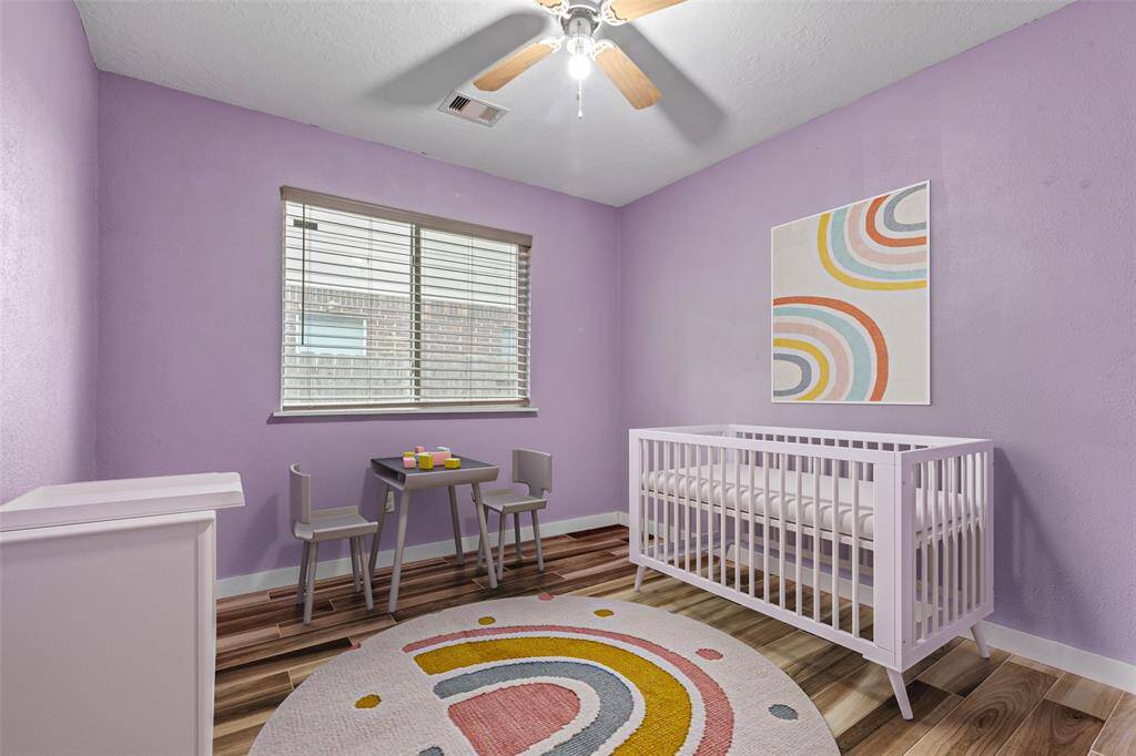 This is the middle bedroom, virtually staged to showcase its potential. Whether you envision it as a guest room, nursery, or creative studio, the space offers flexibility to suit your needs. (Virtually Staged)