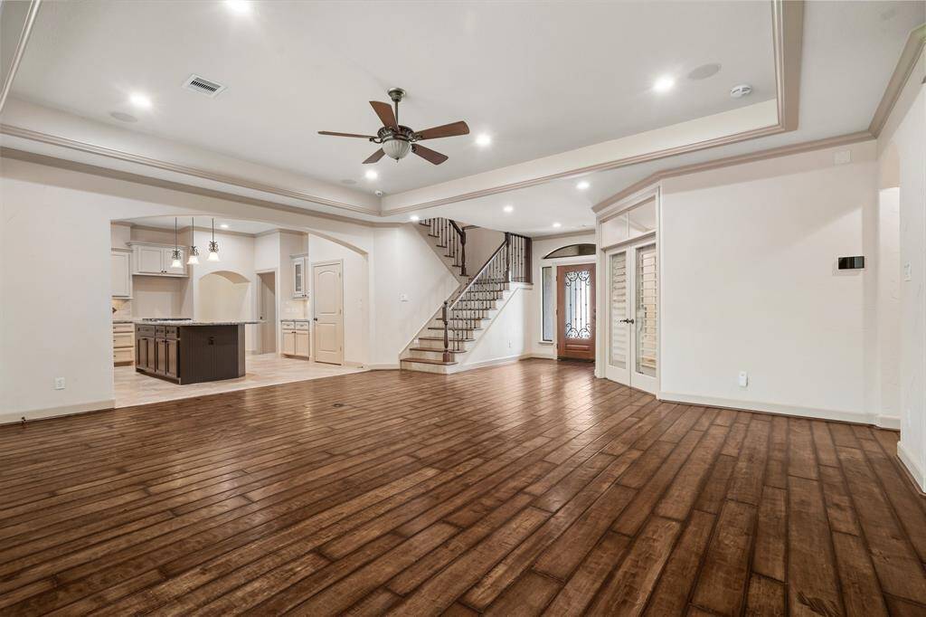 Great Room opens to the kitchen and stairway leads you to 2 additional bedrooms, a jack-n-jill bathroom, game room with balcony and bonus room which is heated & cooled and can be a workout room or storage.