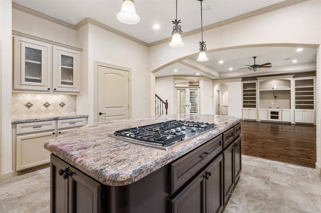 Kitchen has granite countertops, stainless appliances and opens to the dining room and great room.