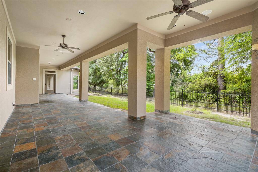 Enlarged covered patio with slate flooring is perfect for entertaining.