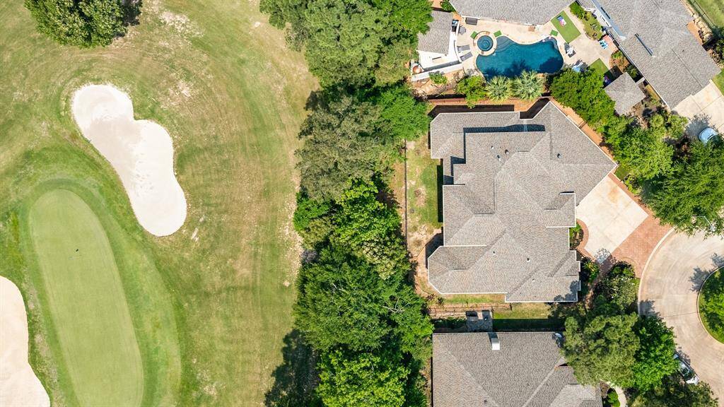Home is located on a cul-de-sac backing to the 13th hole of the Willow Creek Golf Course.