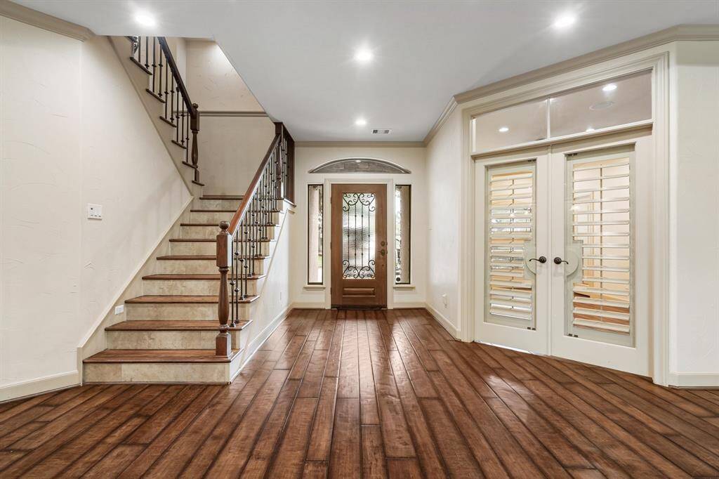 View of the foyer, study with French Doors and Great Room. All have hardwood floors.