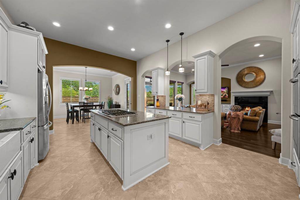 Kitchen provides views through to the breakfast and den areas