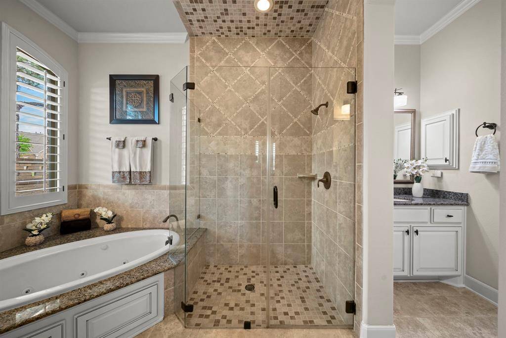 Beautiful tile work on shower provides an elegant shower experience