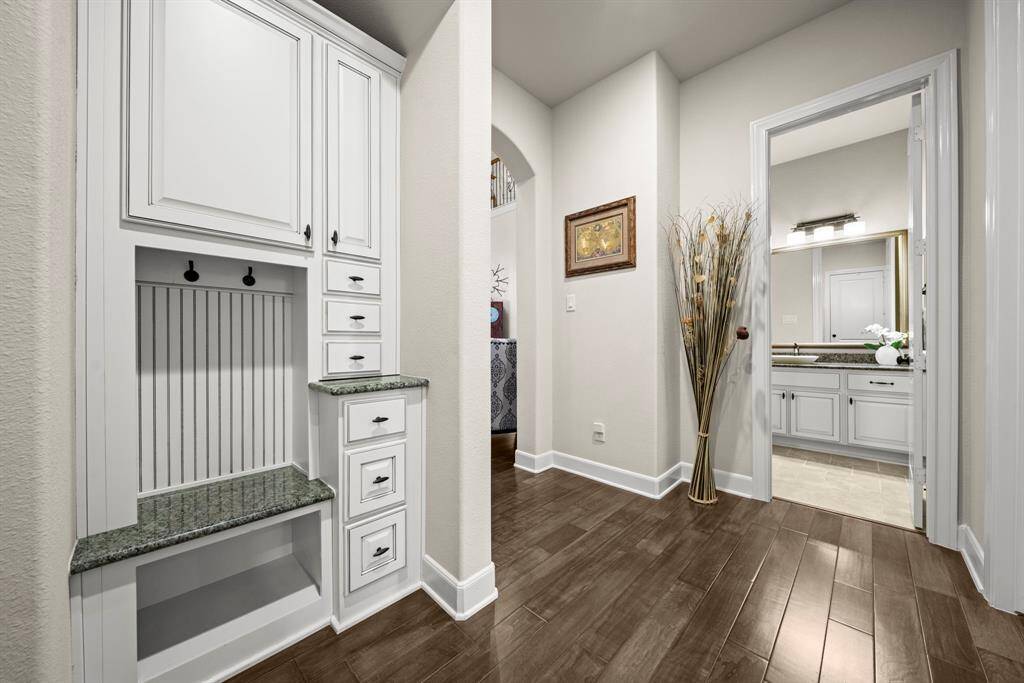 Mud area and closet outside the utility room and garage entry