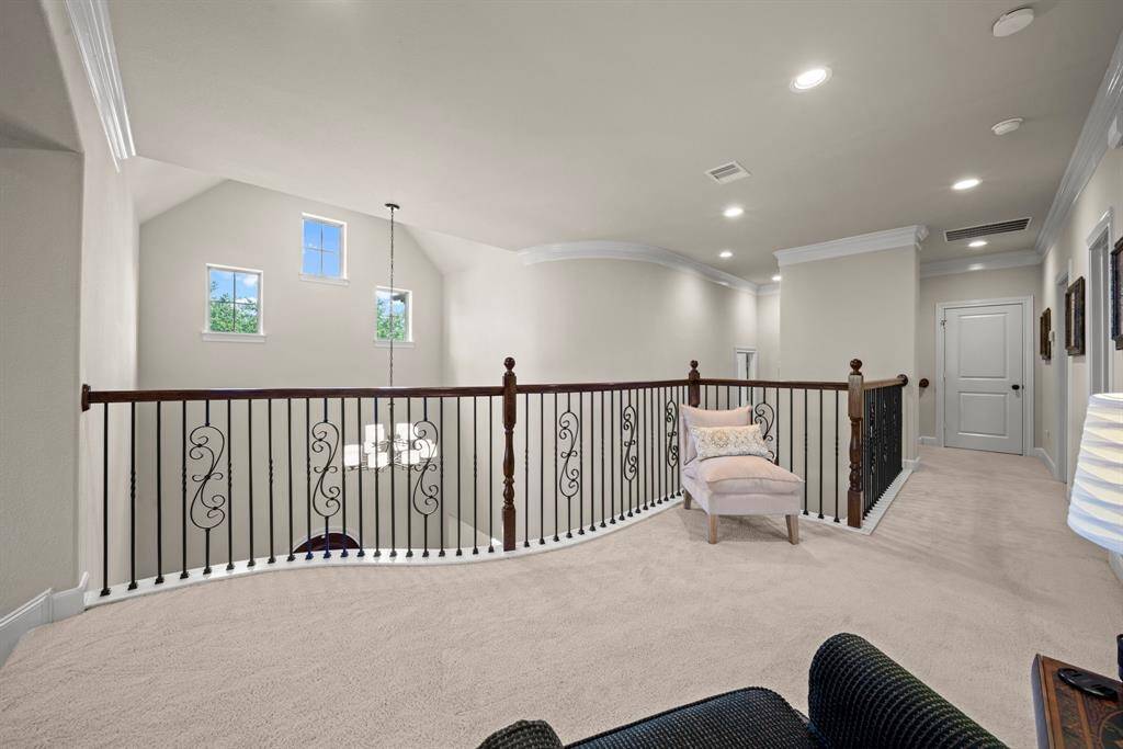This elegant landing area meets you at the top of the stairs and overlooks the entry