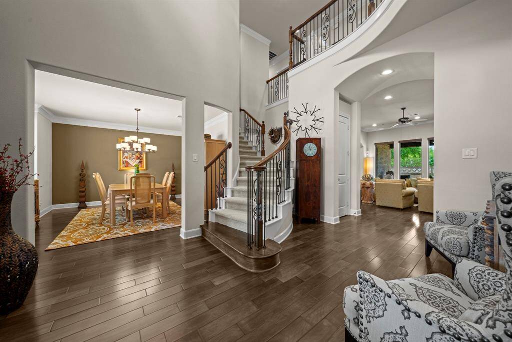 Grand entry with 2 story ceilings, elegant chandelier and open views of the space