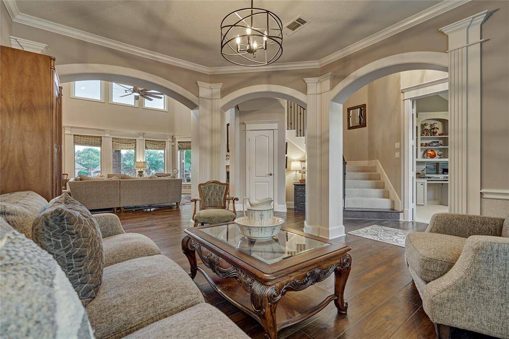 Crisp millwork, neutral tones and stately arches define this space.