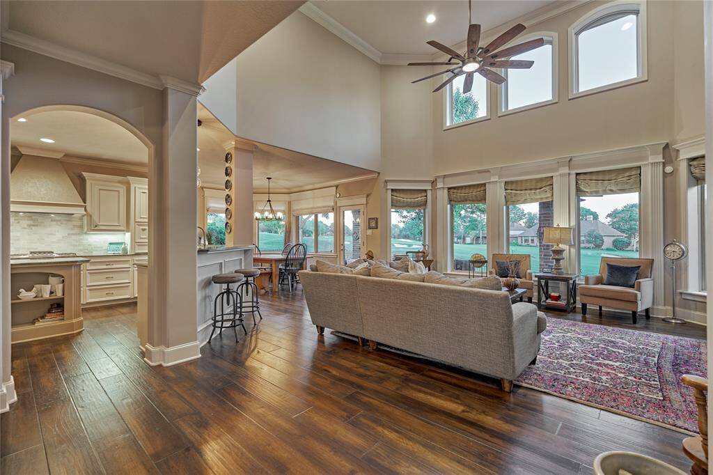 The family room boasts of soaring ceilings and picture windows. Enjoy natural lighting and   breathtaking golf views from every window.