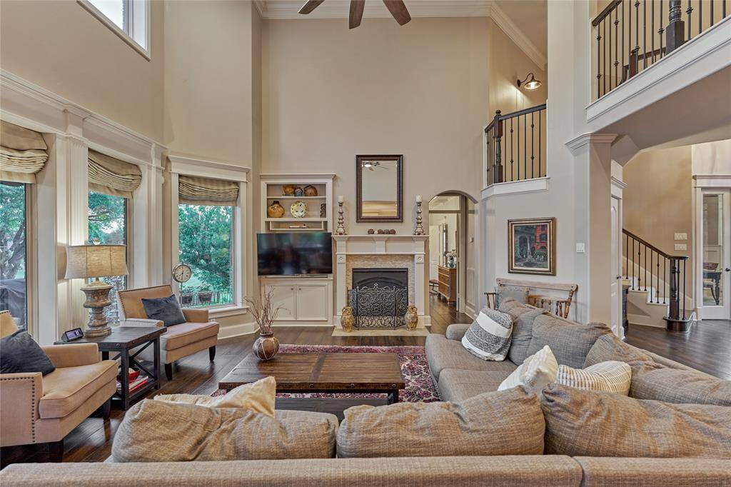 The family room features a cozy fireplace for the cooler months and built-in storage.